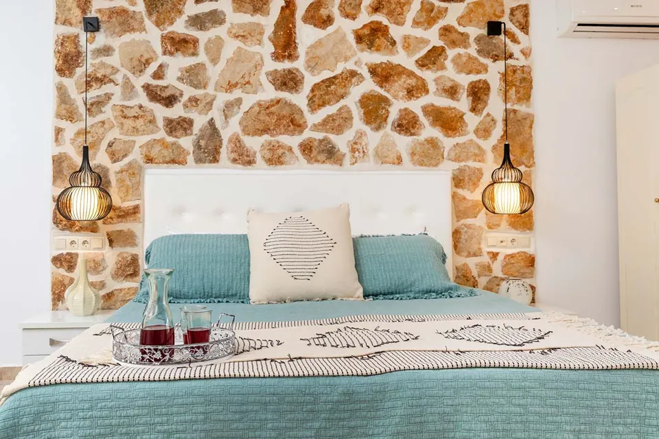 Golden Coast stone wall bedroom